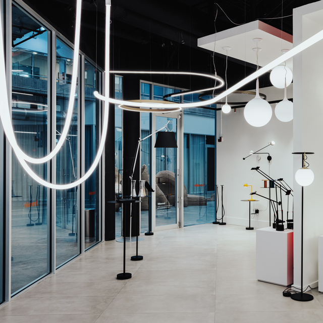 Image of the showroom interior with various Artemide products.