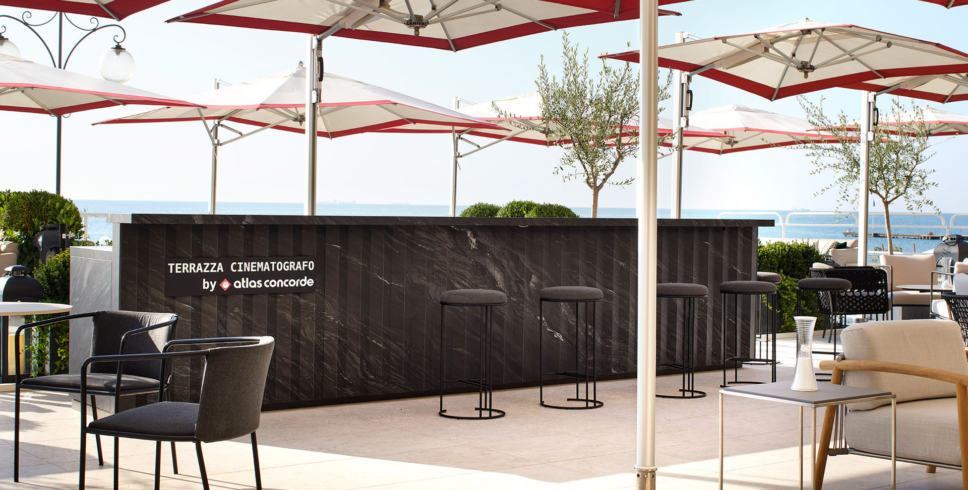 Picture of the cinematograph terrace in Venice with furniture and lamp Come Together by Artemide